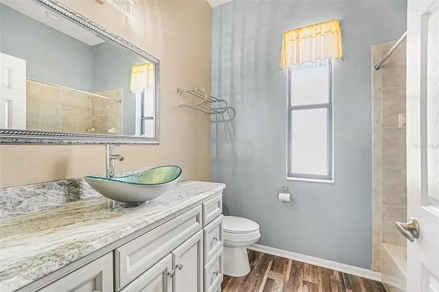 a bedroom with bed and window