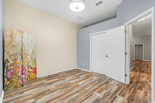 a view of a house with a swimming pool and a yard