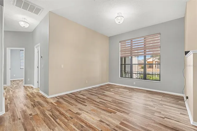 a kitchen with granite countertop a refrigerator and a sink
