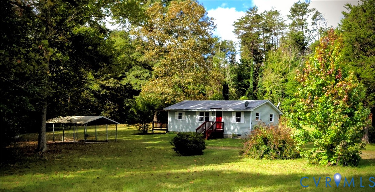 2519 Buckner Road Bumpass, VA 23024 - Photo 2 of 13 a front view of a house with yard porch and green space