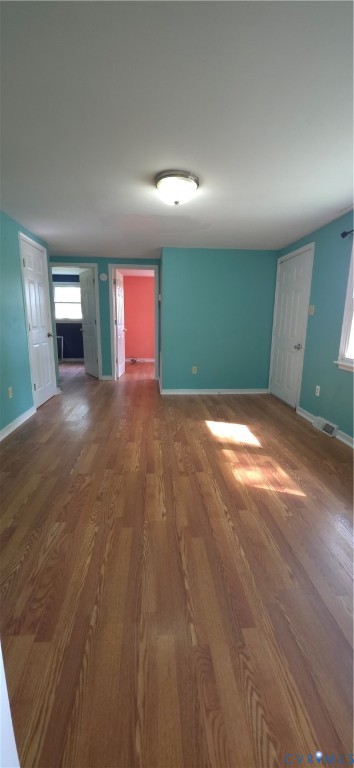 2519 Buckner Road Bumpass, VA 23024 - Photo 8 of 13 an empty room with windows and fireplace