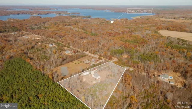 a aerial view of a house with a yard