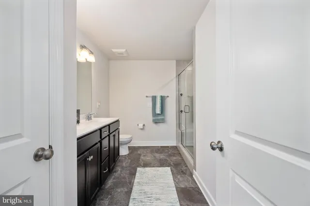a view of house with outdoor space and wooden fence