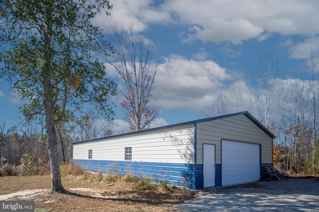 an aerial view of ocean residential houses with outdoor space and swimming pool