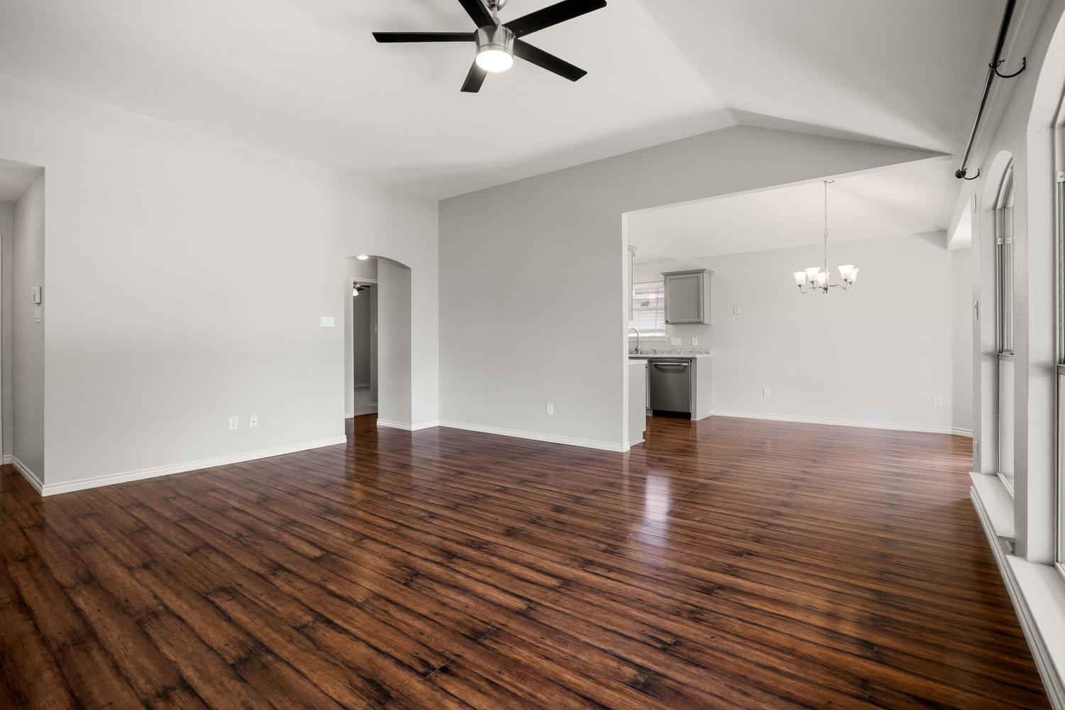 521 Britni Loop Kyle, TX 78640 - Photo 4 of 23 a view of empty room with wooden floor and window