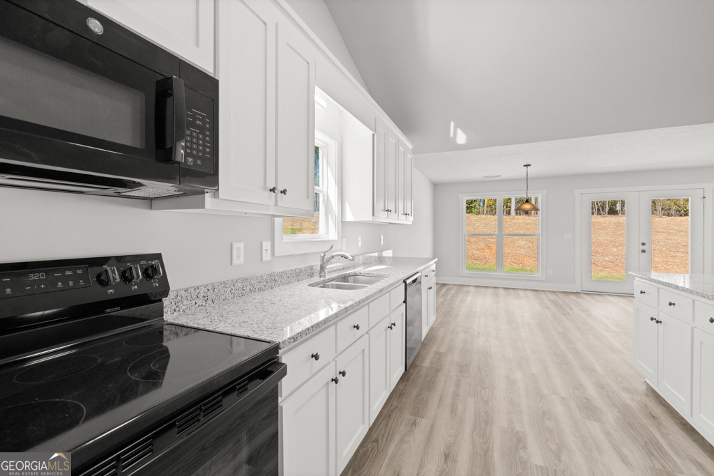 522 Oil Mill Road, Unit 10 Martin, GA 30557 - Photo 11 of 30 a kitchen with a stove and a microwave