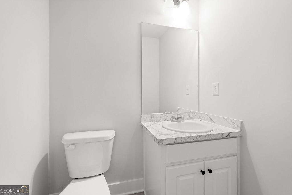 522 Oil Mill Road, Unit 10 Martin, GA 30557 - Photo 13 of 30 a bathroom with a toilet sink and mirror