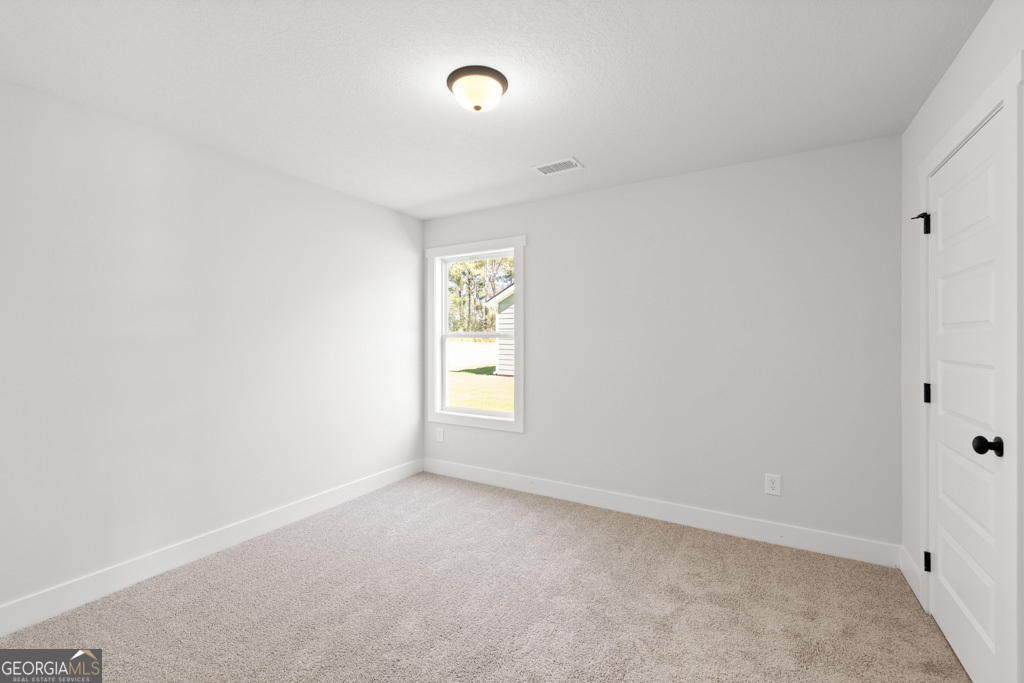 522 Oil Mill Road, Unit 10 Martin, GA 30557 - Photo 18 of 30 an empty room with windows