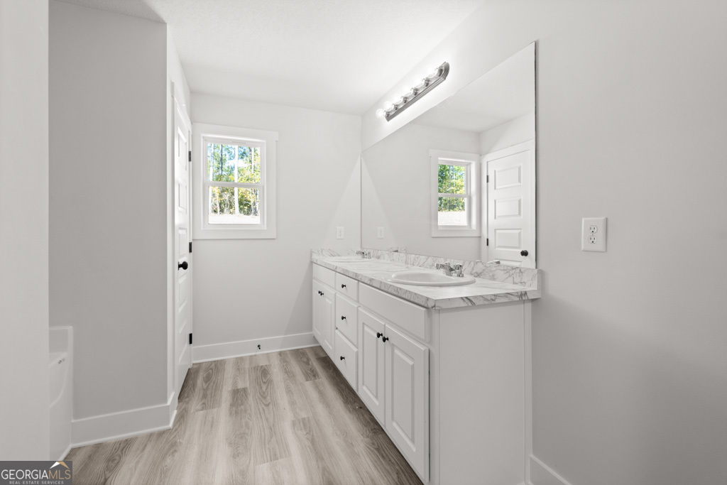 522 Oil Mill Road, Unit 10 Martin, GA 30557 - Photo 26 of 30 a bathroom with a sink a mirror and a window