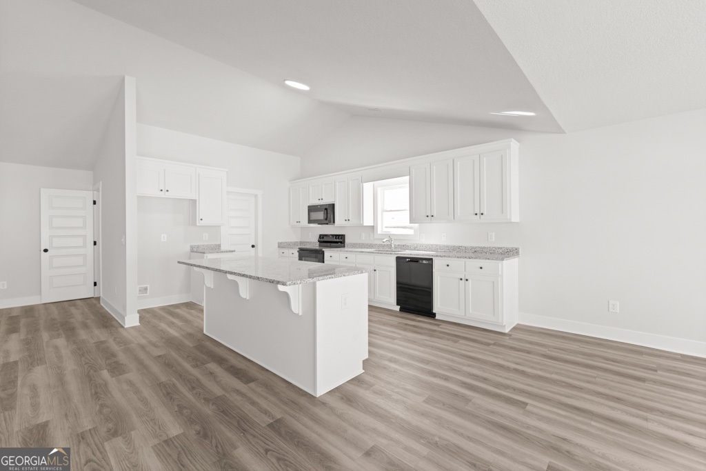 522 Oil Mill Road, Unit 10 Martin, GA 30557 - Photo 8 of 30 a kitchen with white cabinets and white appliances