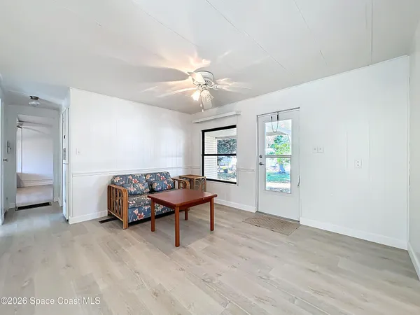 a living room with furniture and a window