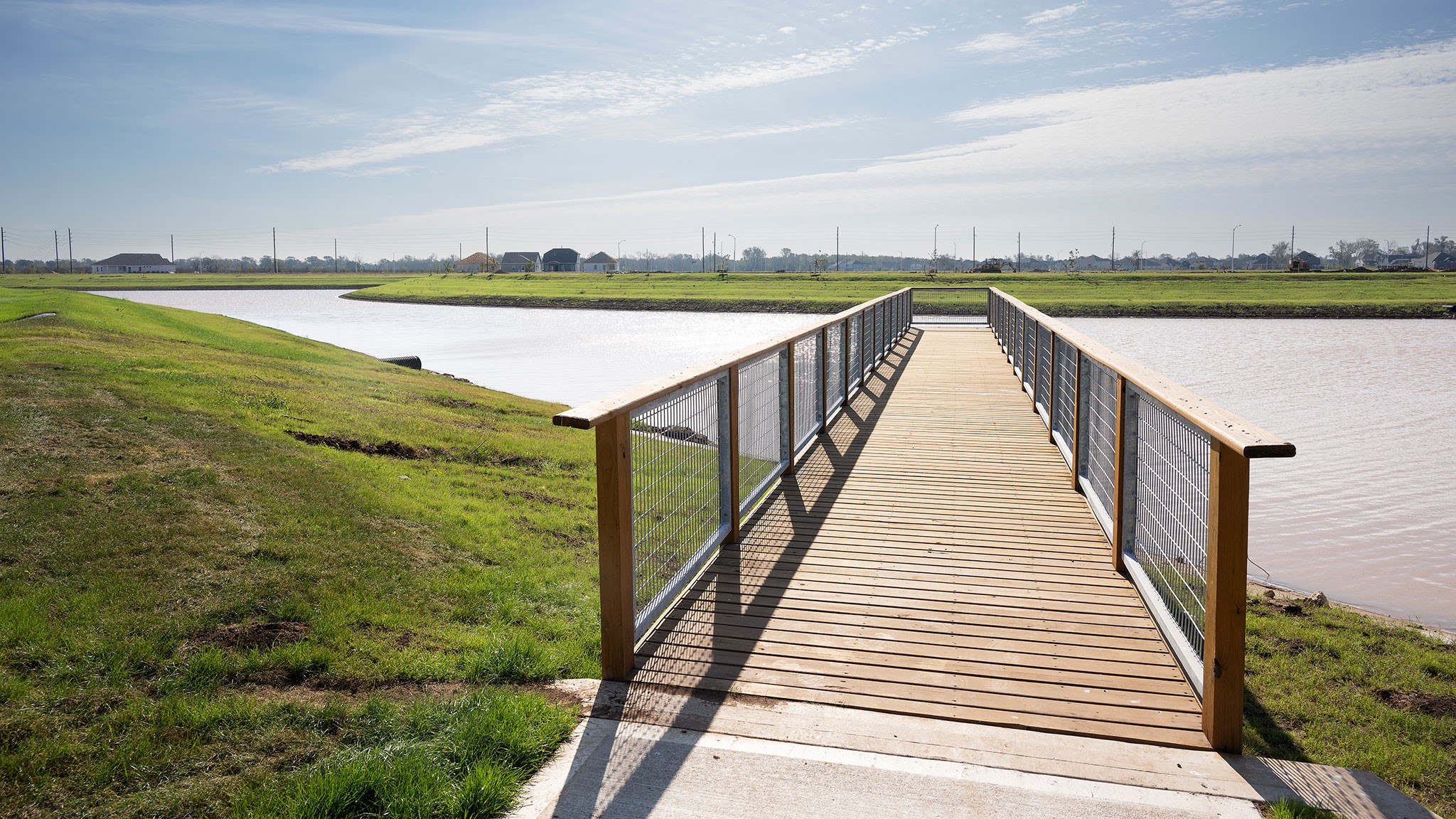 32406 Sedge Sprite Court Fulshear, TX 77441 - Photo 6 of 8 a view of a lake with a outdoor space