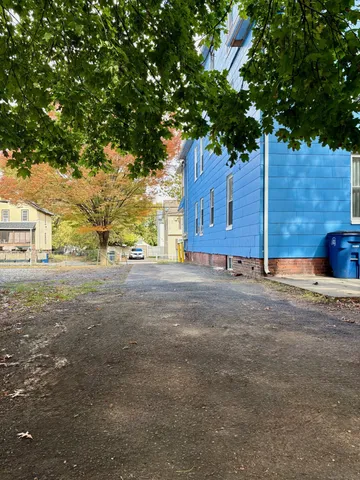 a view of a house with a tree