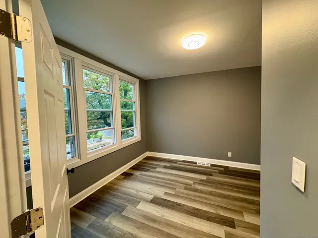 a view of an empty room with a window