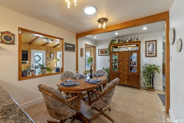a kitchen with stainless steel appliances granite countertop a sink a refrigerator and a stove