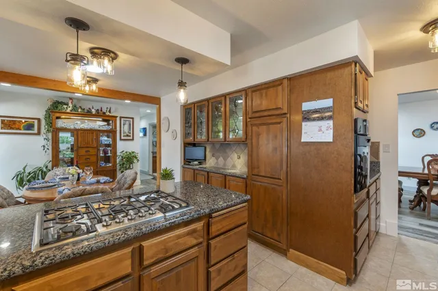 a kitchen with a refrigerator and a sink