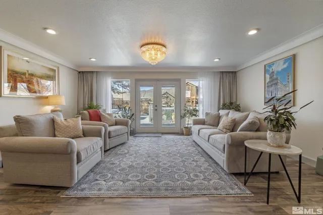 a living room with furniture or couch and a wooden floor