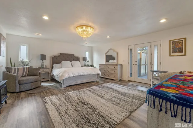 a bedroom with bed and window