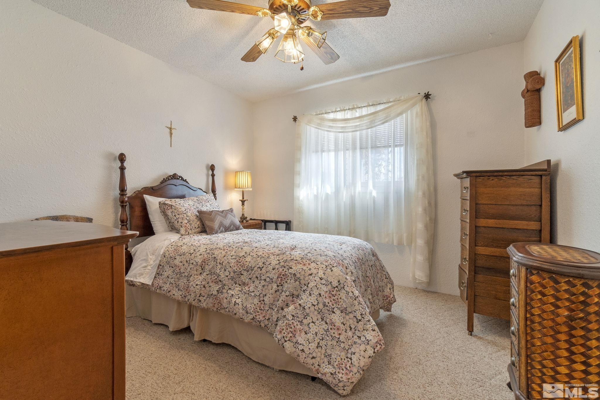 525 Main Street Gerlach, NV 89412 - Photo 30 of 40 a bedroom with bed and window