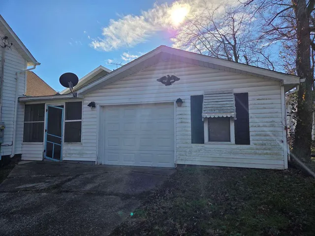 an empty room with windows and entrance