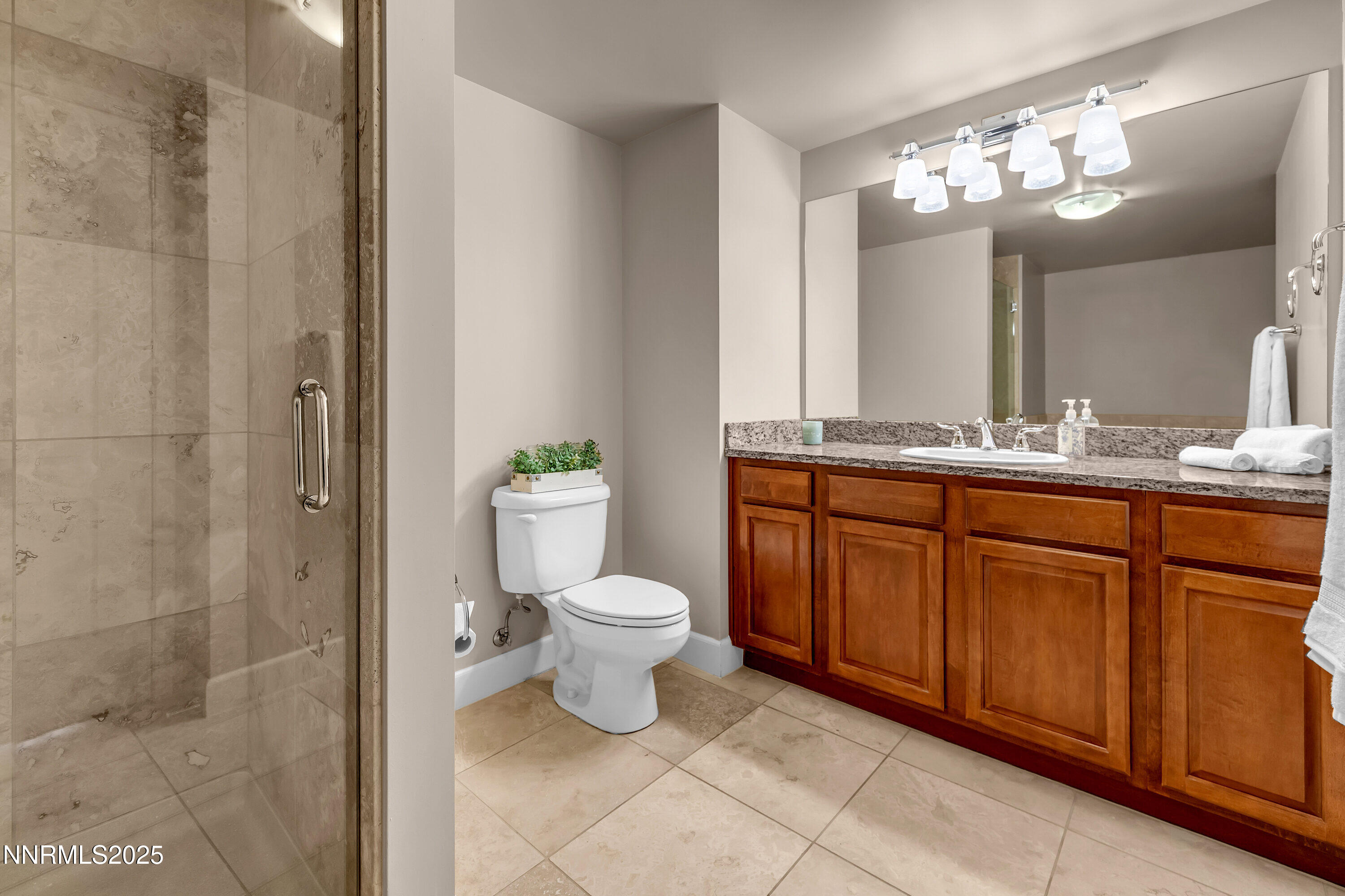 50 North Sierra Street, Unit 910 Reno, NV 89501 - Photo 15 of 20 a bathroom with a toilet sink and mirror