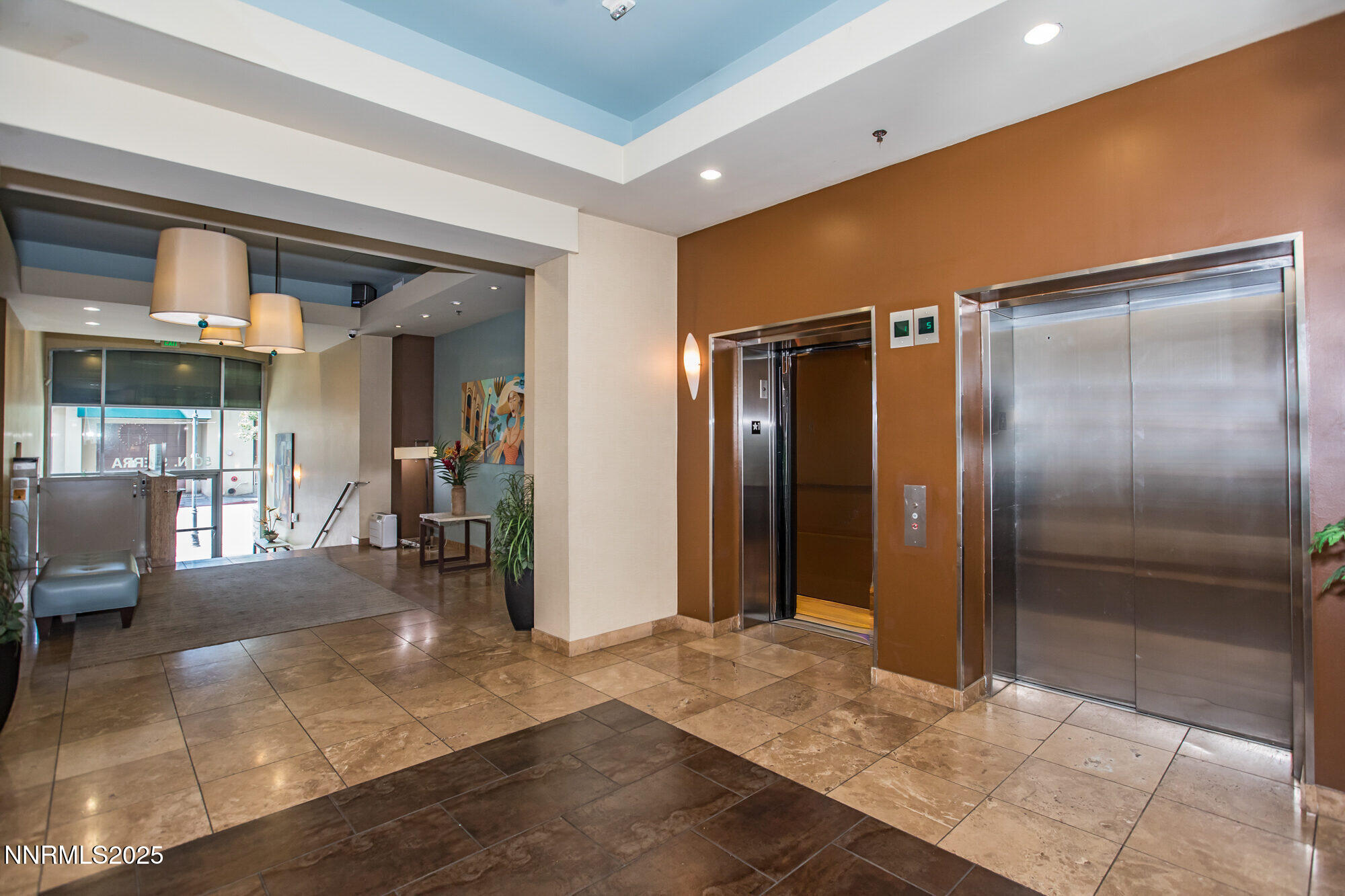 50 North Sierra Street, Unit 910 Reno, NV 89501 - Photo 19 of 20 a view of a hallway with dining area and glass door