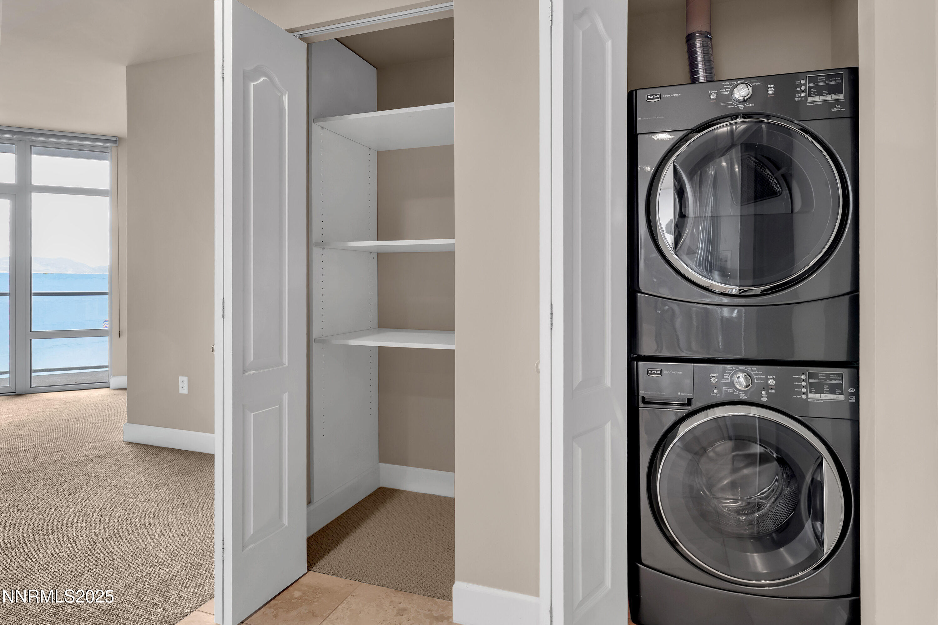 50 North Sierra Street, Unit 910 Reno, NV 89501 - Photo 7 of 20 a view of a hallway with washer and dryer
