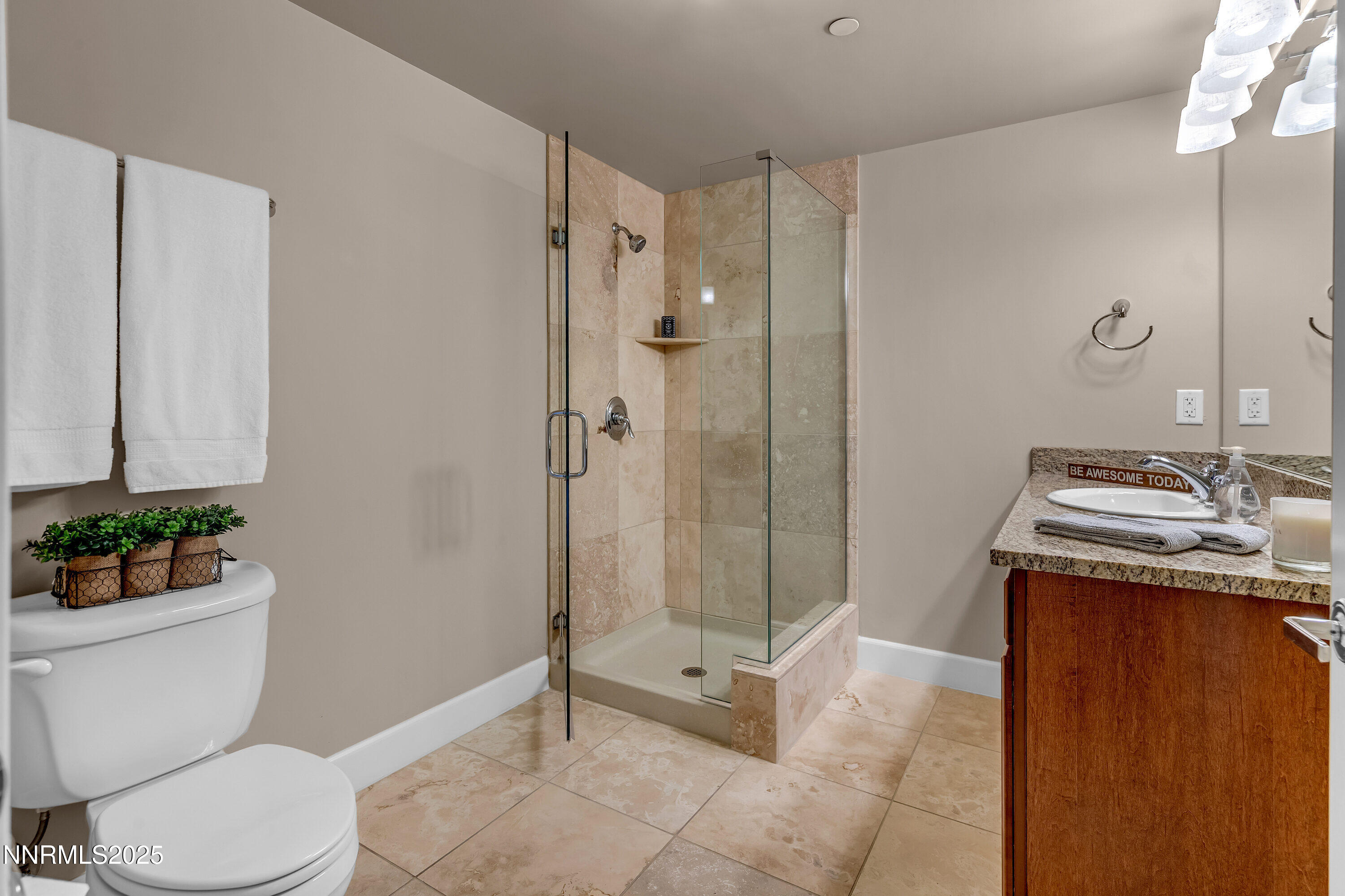 50 North Sierra Street, Unit 910 Reno, NV 89501 - Photo 10 of 20 a bathroom with a sink a toilet a mirror and shower