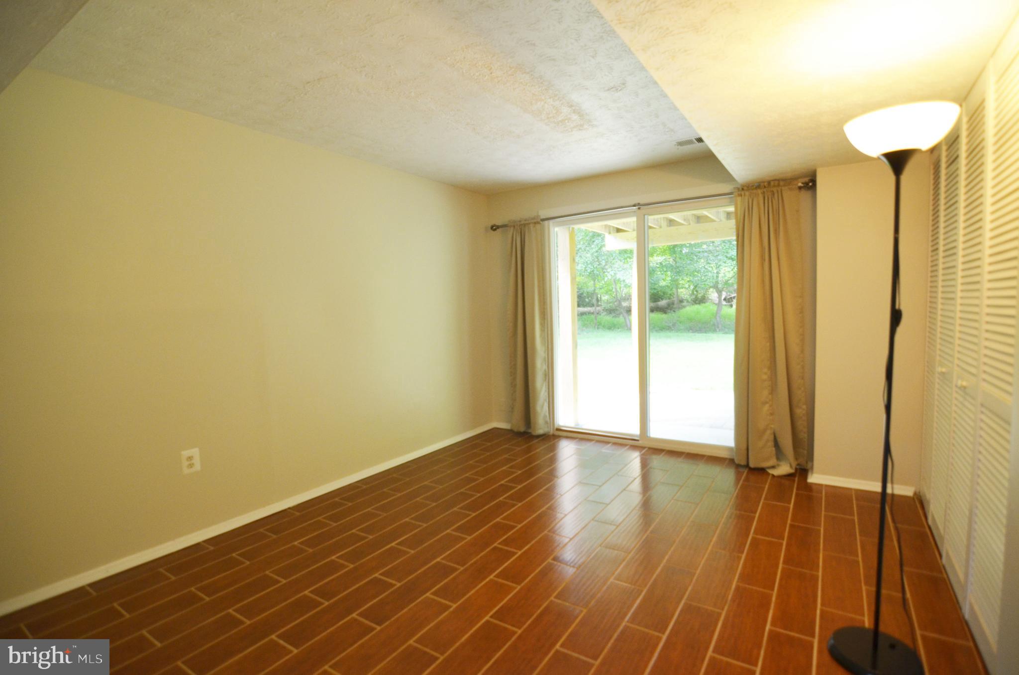 9251 Perfect Hour Columbia, MD 21045 - Photo 15 of 19 Access to rear patio and yard