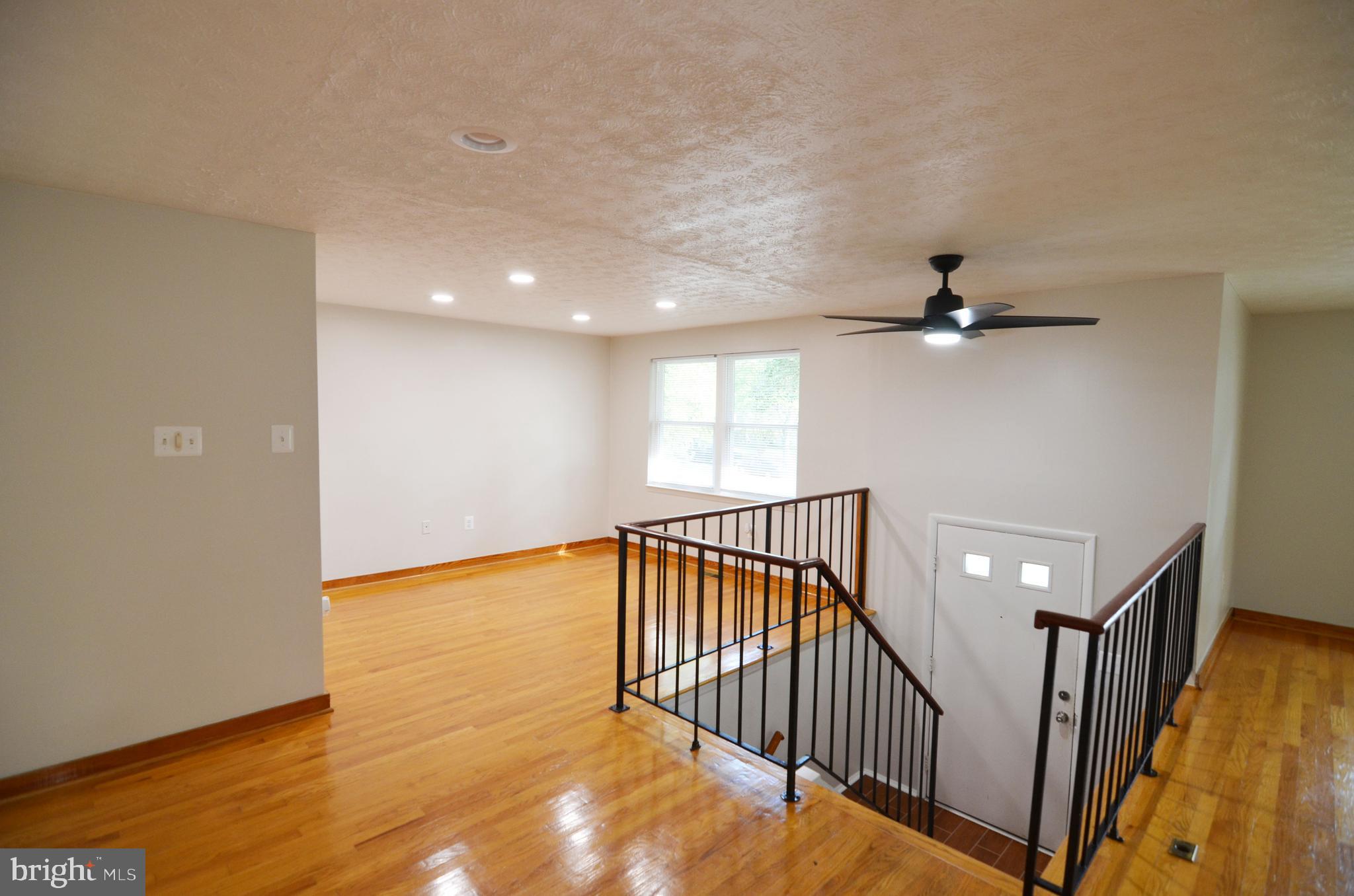 9251 Perfect Hour Columbia, MD 21045 - Photo 7 of 19 Main level with hardwood floors and recessed light