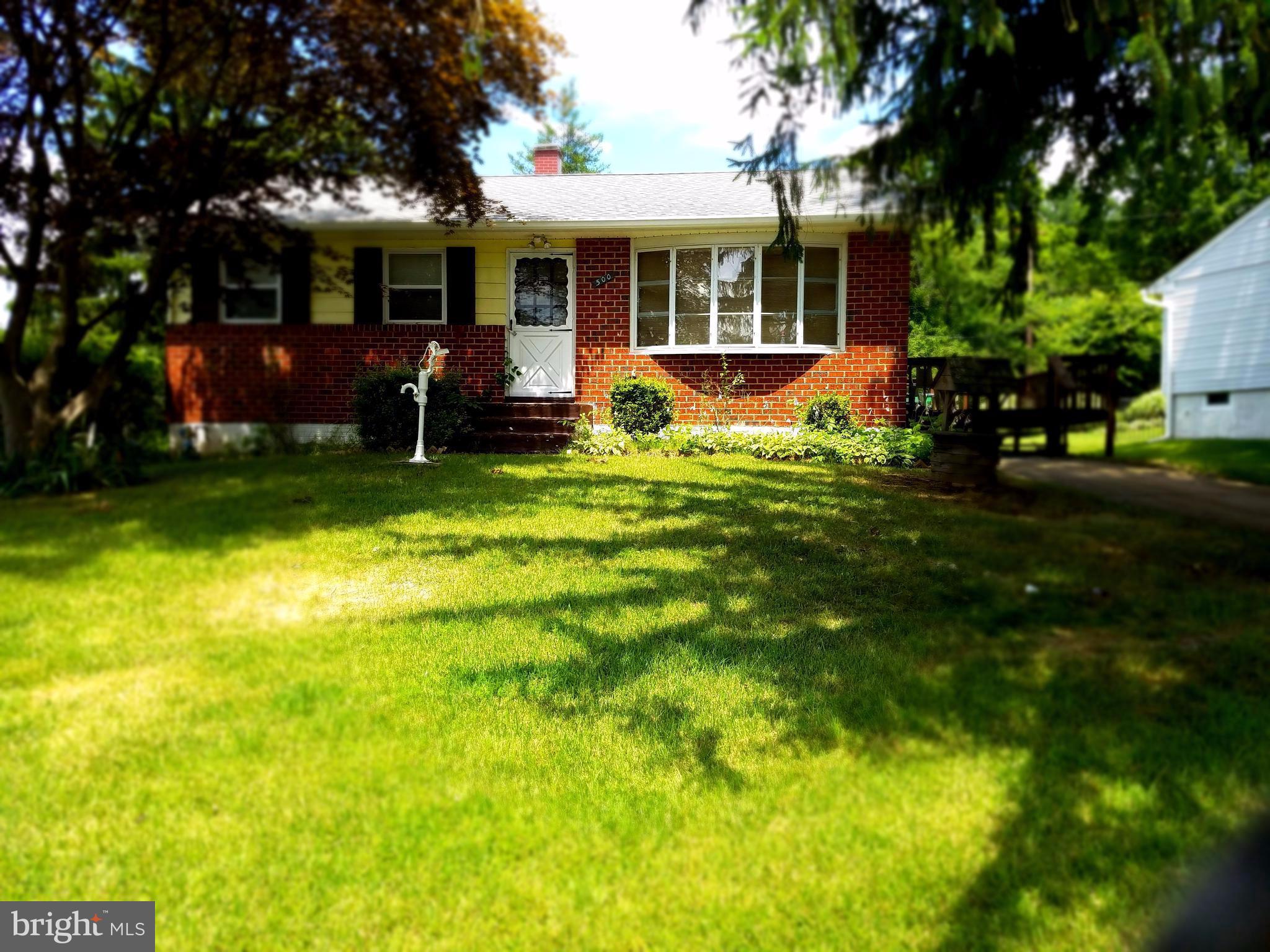 500 Hammershire Road Owings Mills, MD 21117 - Photo 1 of 13 a front view of house with yard and green space