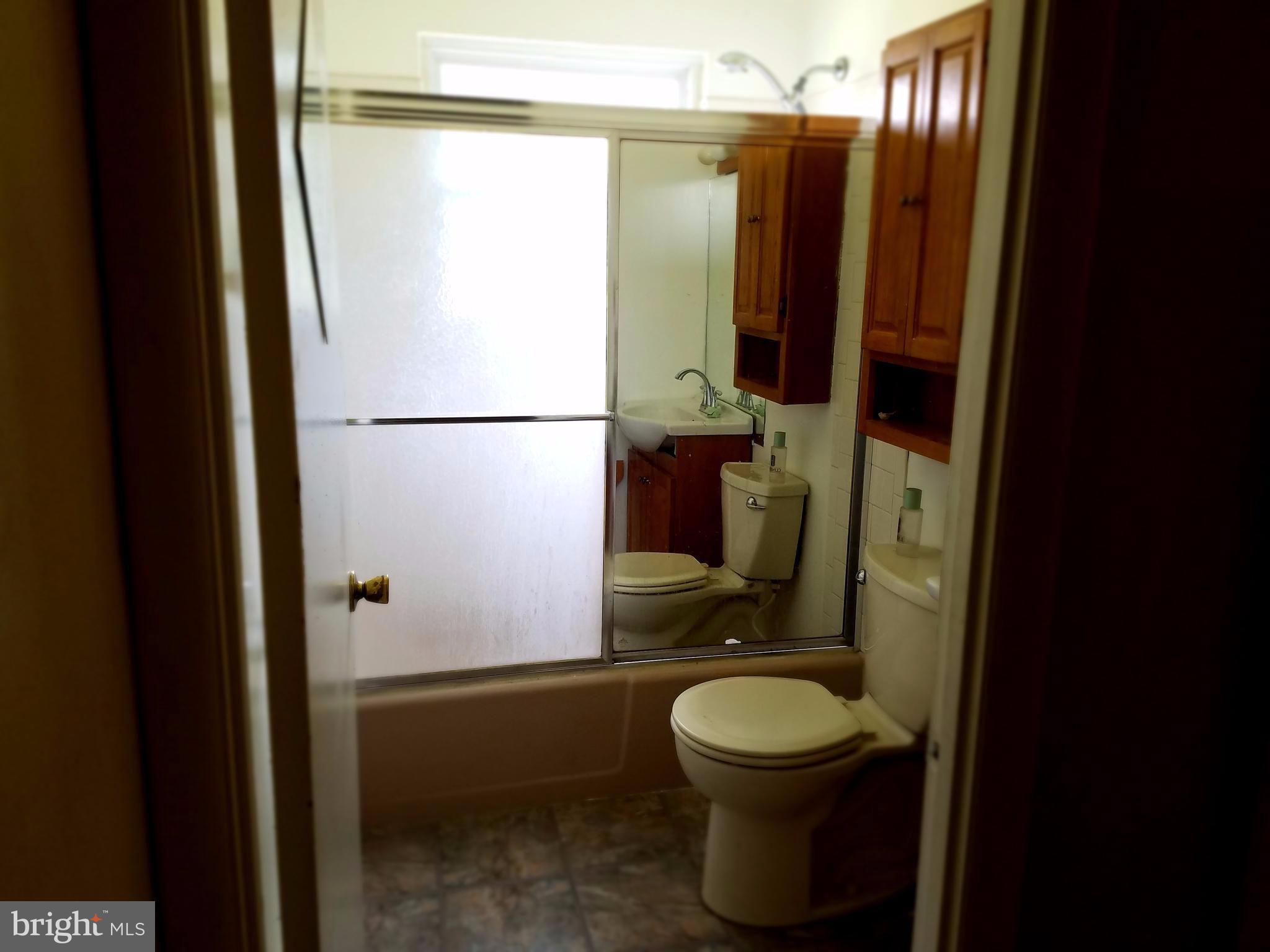 500 Hammershire Road Owings Mills, MD 21117 - Photo 9 of 13 a bathroom with a toilet sink and mirror
