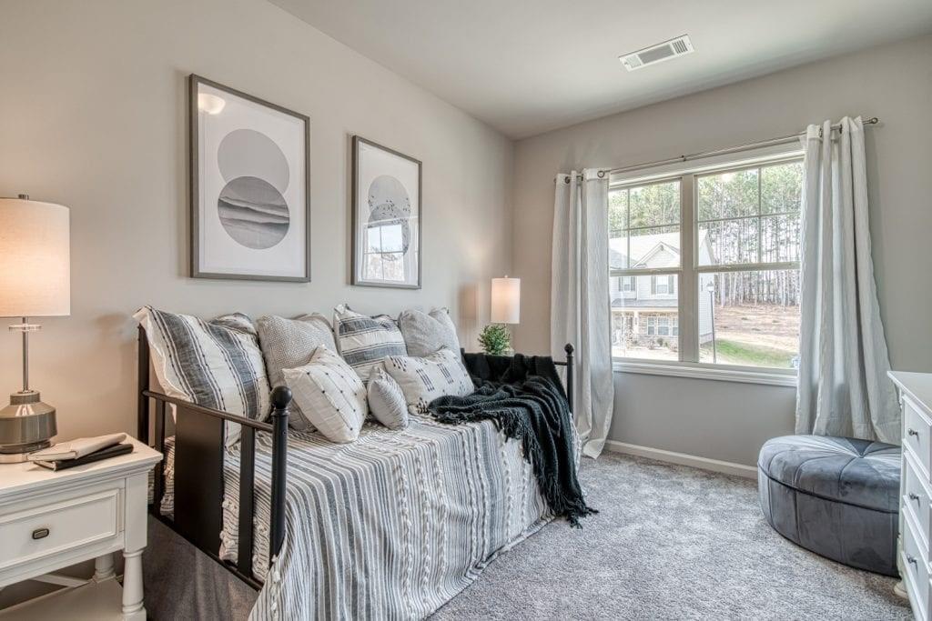 663 Secret Garden Lane Dacula, GA 30019 - Photo 11 of 27 a bedroom with double bed and a window