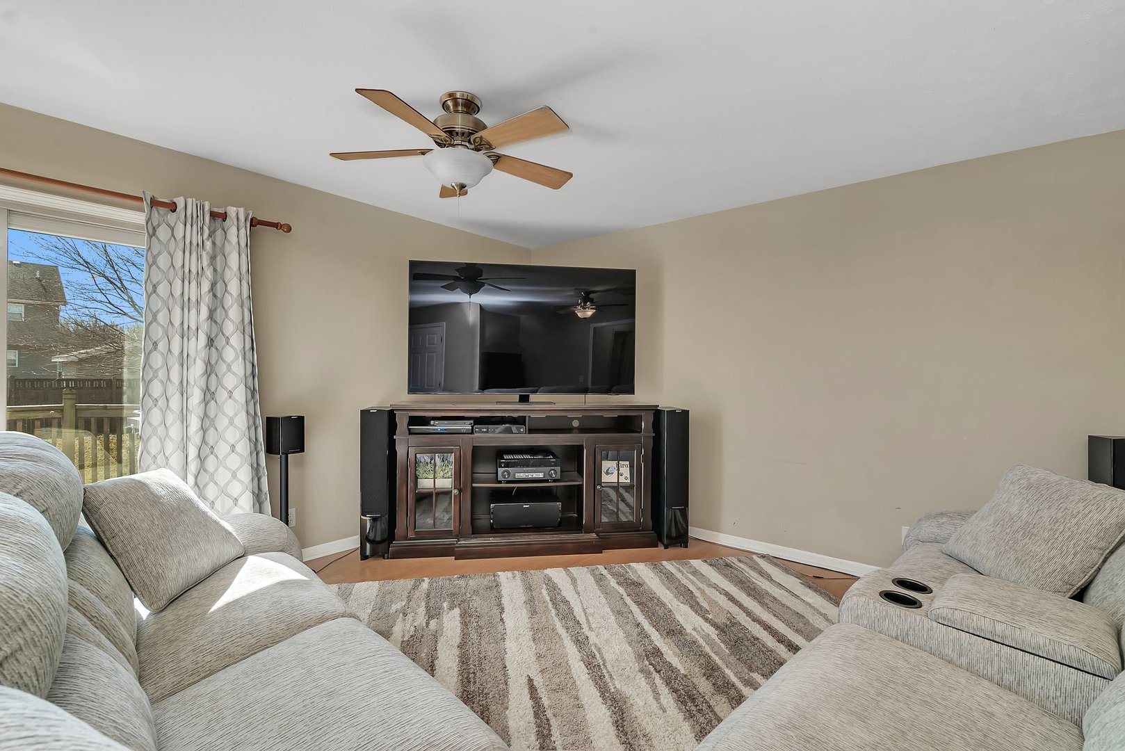 999 West Cermak Road Braidwood, IL 60408 - Photo 4 of 36 a living room with a bed and a flat screen tv