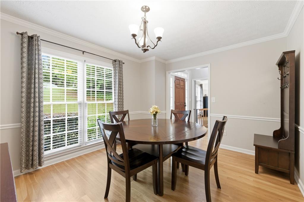 1925 Crescent Ridge Cumming, GA 30041 - Photo 11 of 36 a view of a dining room with furniture window and wooden floor