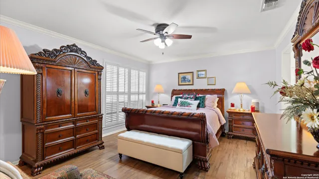 a bedroom with furniture and a window