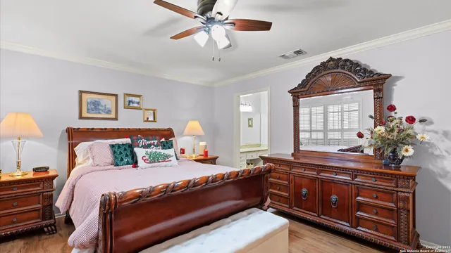 a bed room with a bed and a chandelier