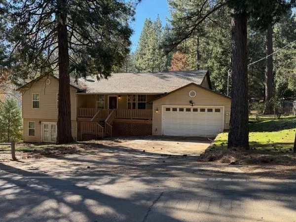 a house with trees in the background