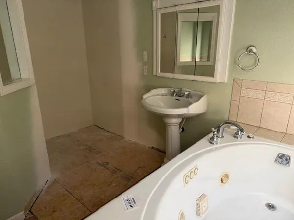 a bathroom with a sink and a mirror