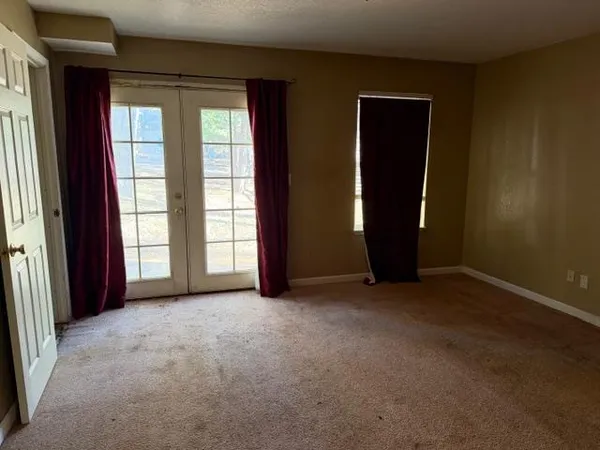 an empty room with empty shelves