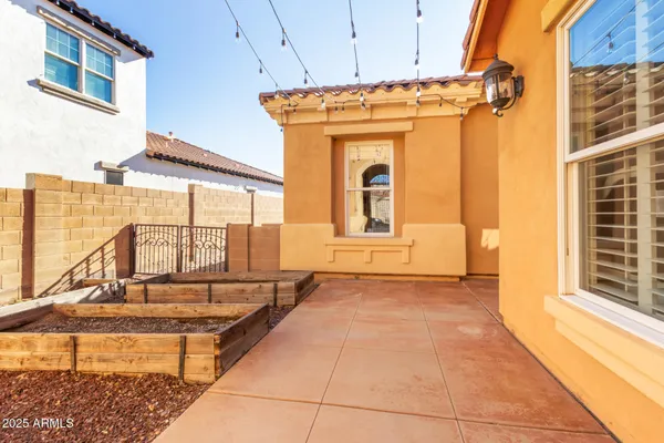 a view of a house with backyard porch and sitting area