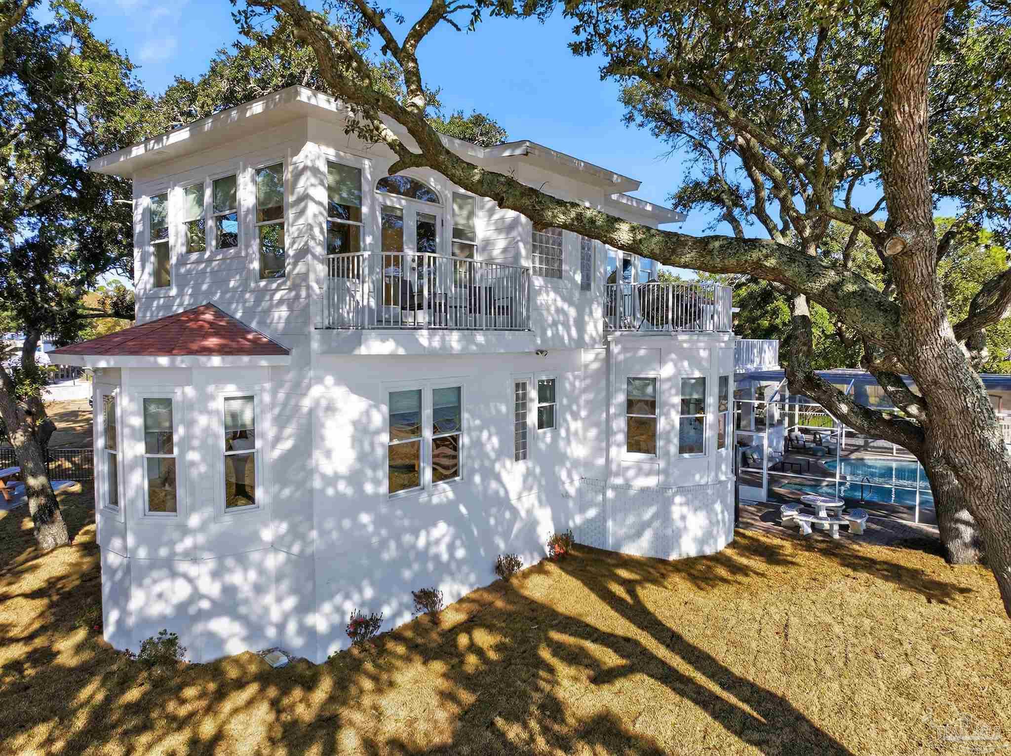 39 Mariners Lane Mary Esther, FL 32569 - Photo 5 of 70 a view of a building with a yard