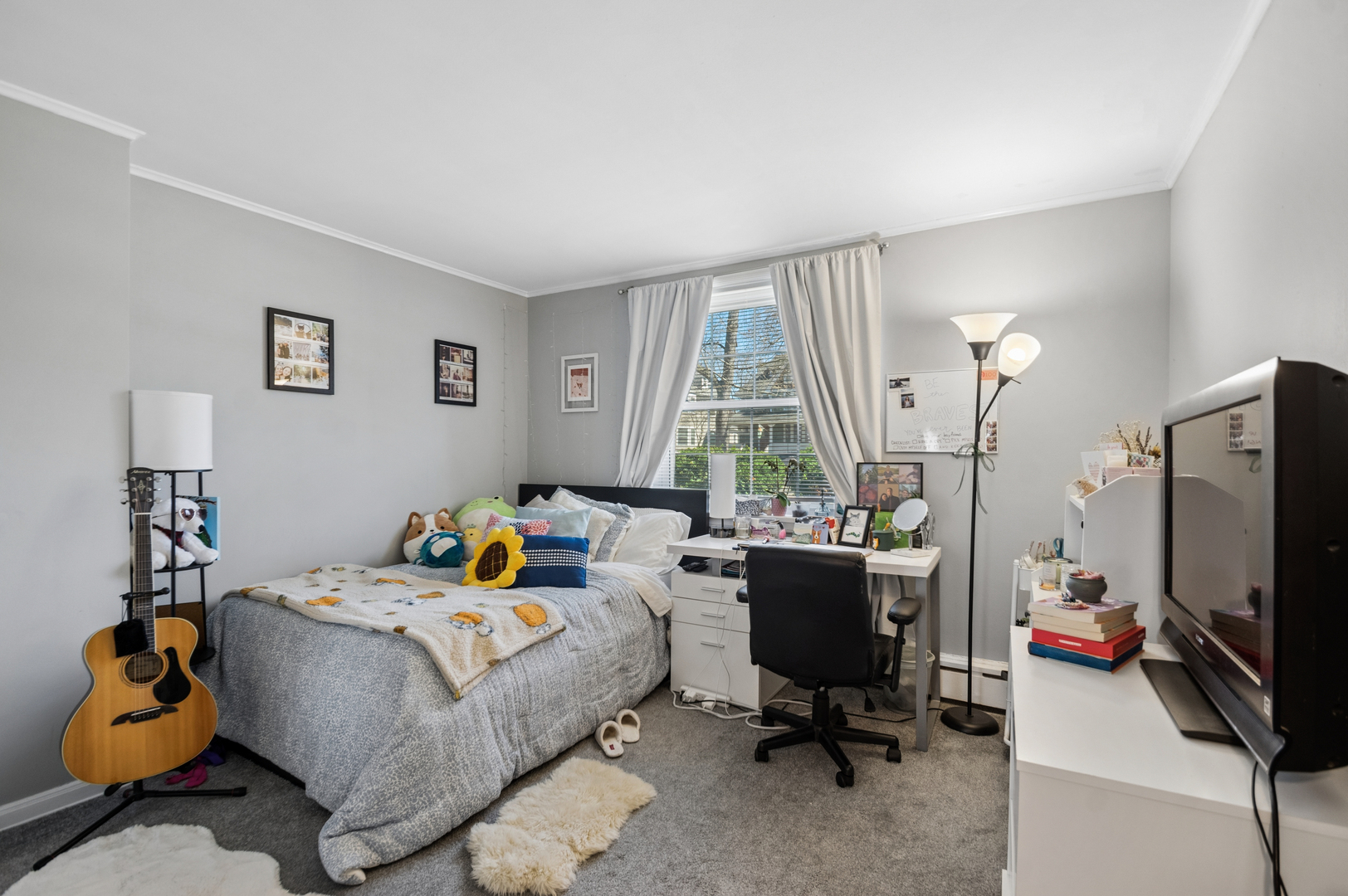 2242 Sherman Avenue, Unit G Evanston, IL 60201 - Photo 11 of 17 a bedroom with a bed a large window and chair