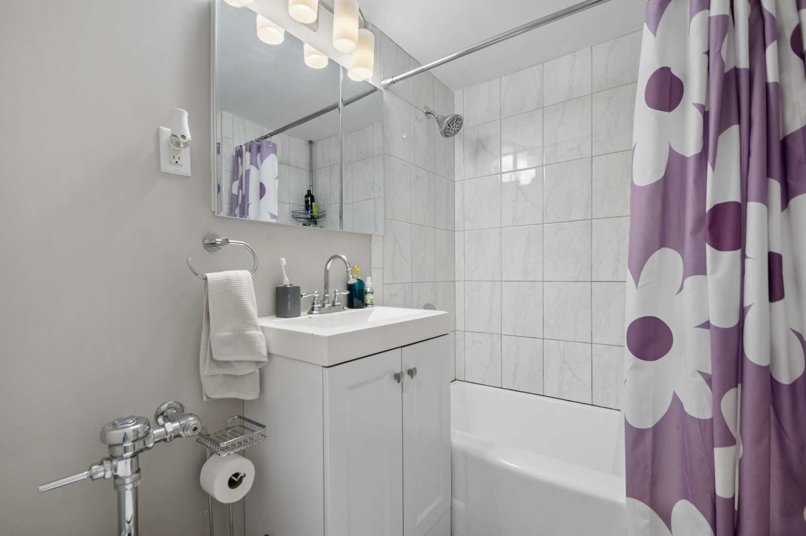 2242 Sherman Avenue, Unit G Evanston, IL 60201 - Photo 12 of 17 a bathroom with a sink toilet and shower