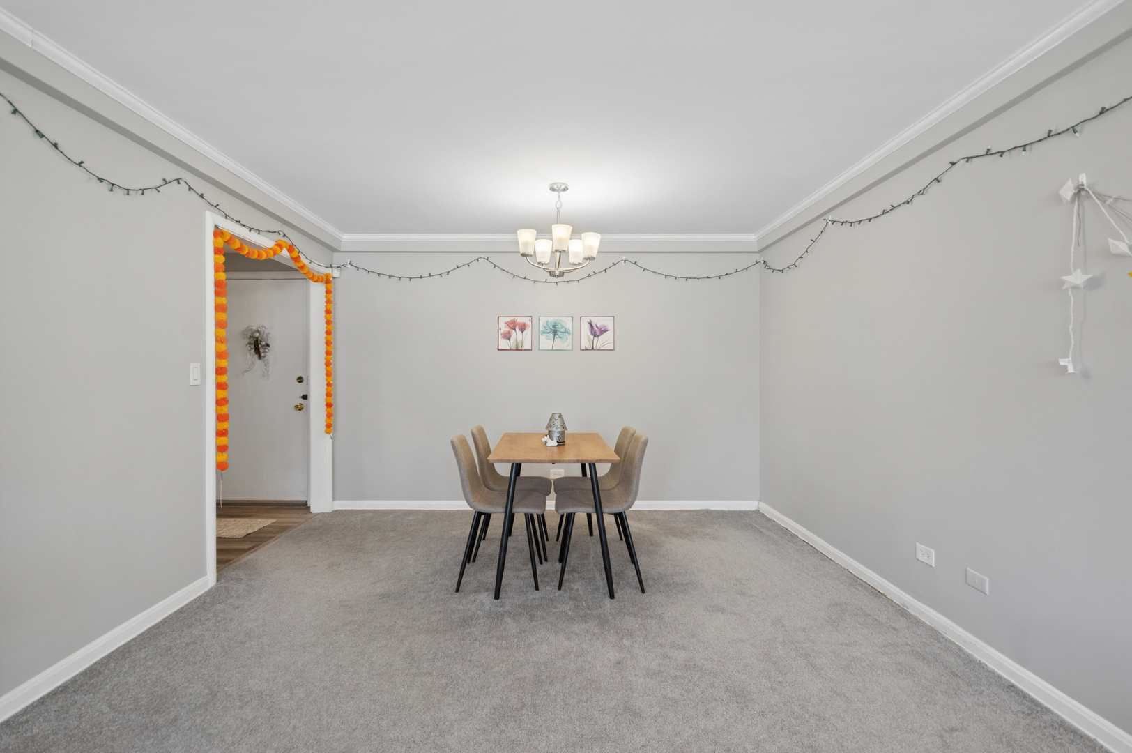 2242 Sherman Avenue, Unit G Evanston, IL 60201 - Photo 6 of 17 a dining room with furniture and chandelier fan