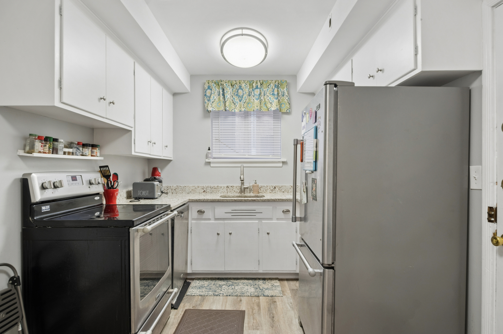 2242 Sherman Avenue, Unit G Evanston, IL 60201 - Photo 9 of 17 a kitchen with refrigerator cabinets and a sink