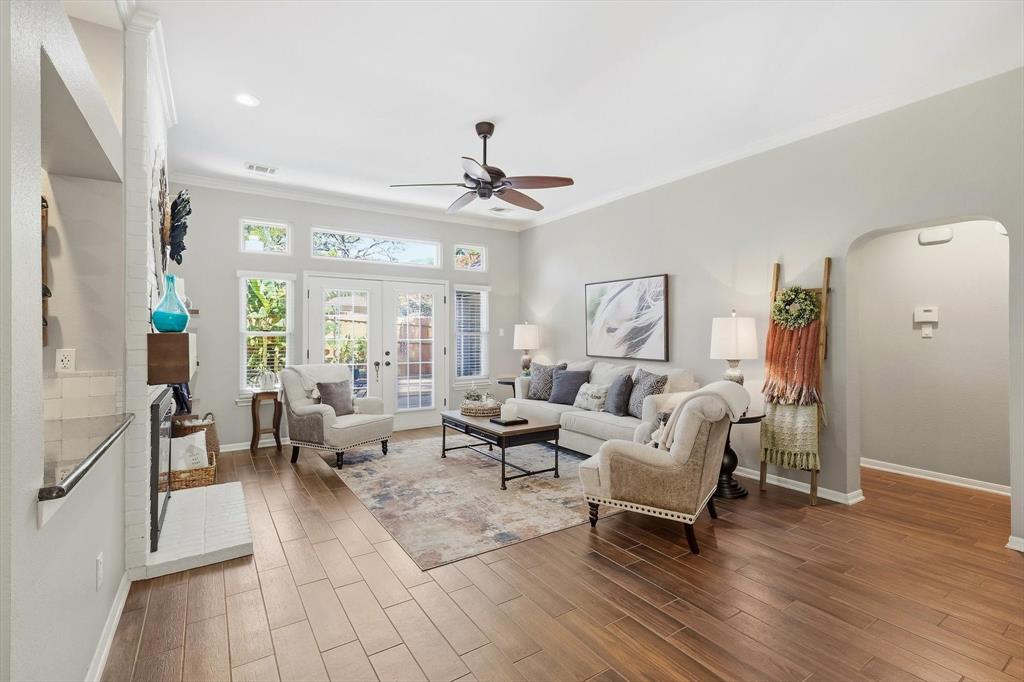 524 Post Oak Road Grapevine, TX 76051 - Photo 7 of 37 Spacious living area featuring wood-finish flooring, a ceiling fan, and crown molding