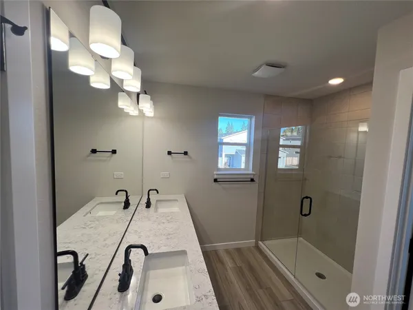 a bathroom with a sink and a large mirror