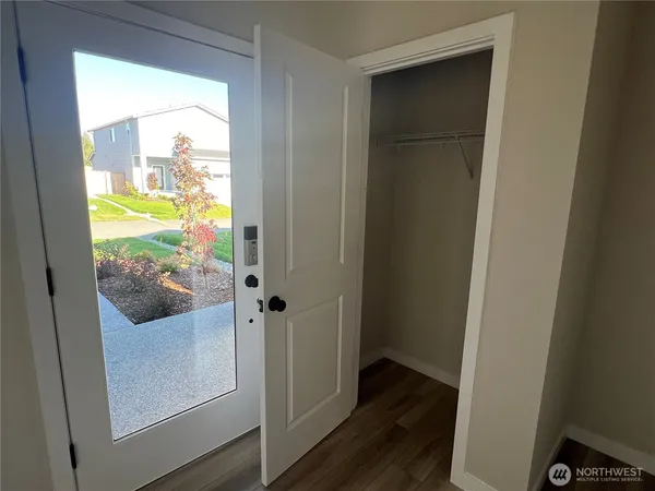 a view of walk in closet with empty racks