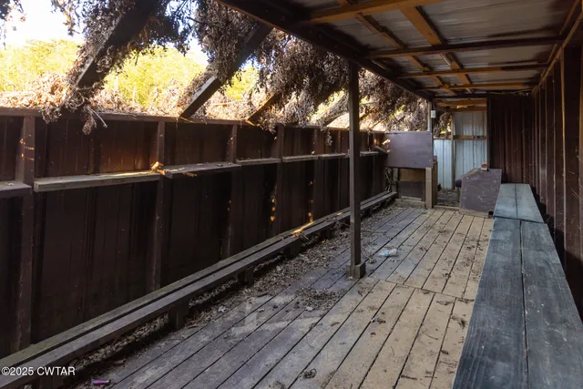 a view of balcony with wooden floor